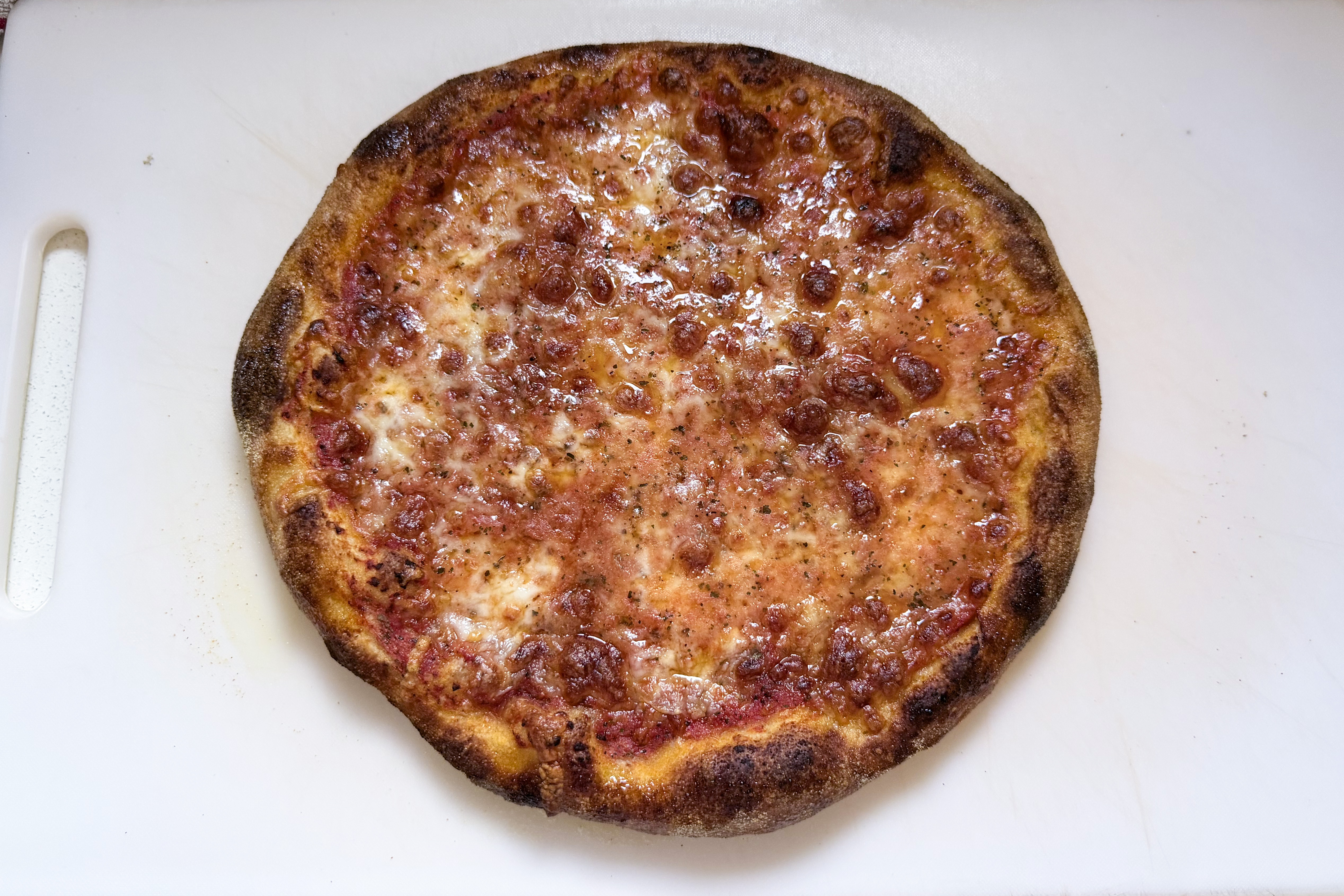 A pizza on a chopping board