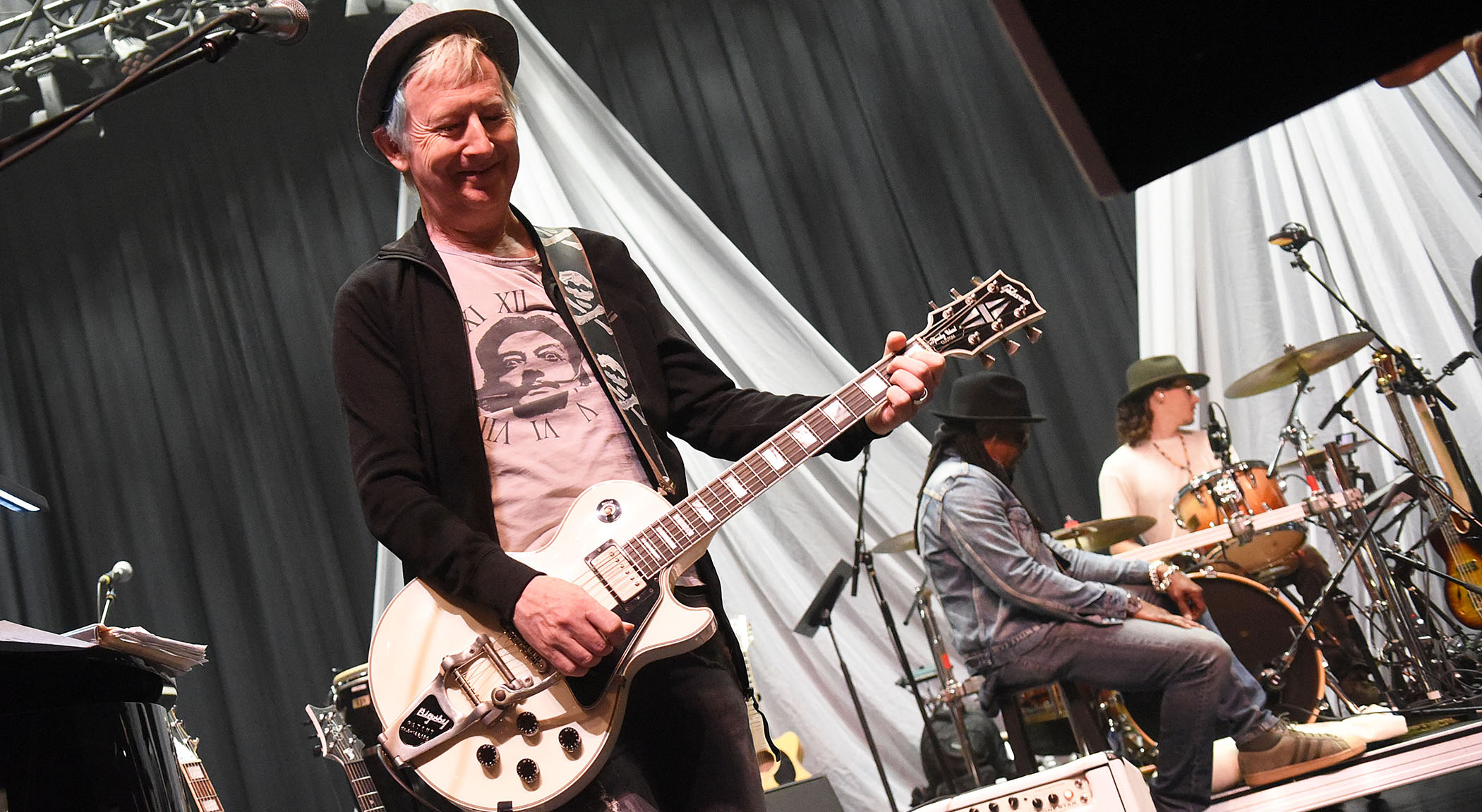 Gerry Leonard plays a Les Paul Custom at a David Bowie tribute show sound check.