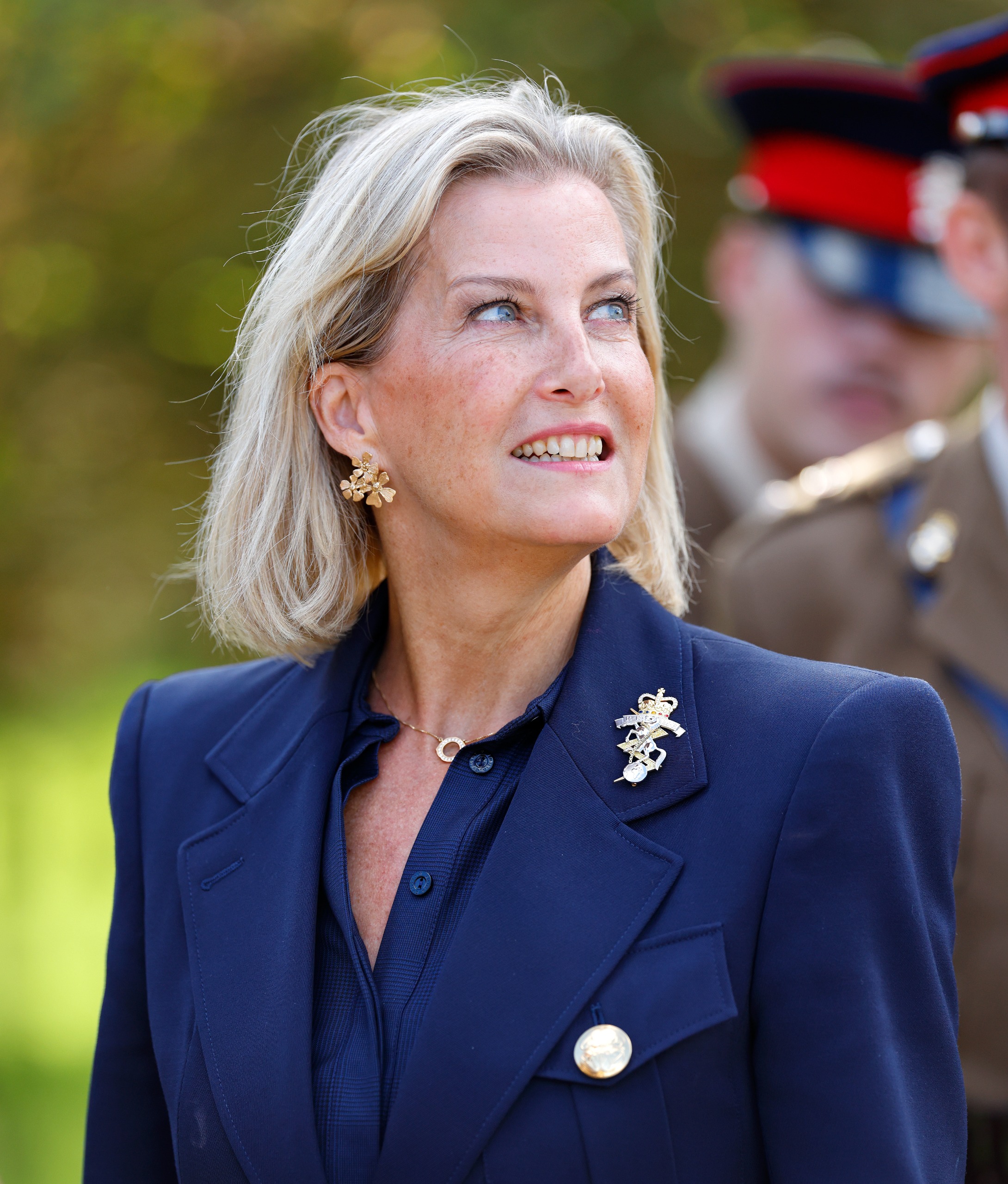 Duchess Sophie wearing a blue blazer and looking up to the right