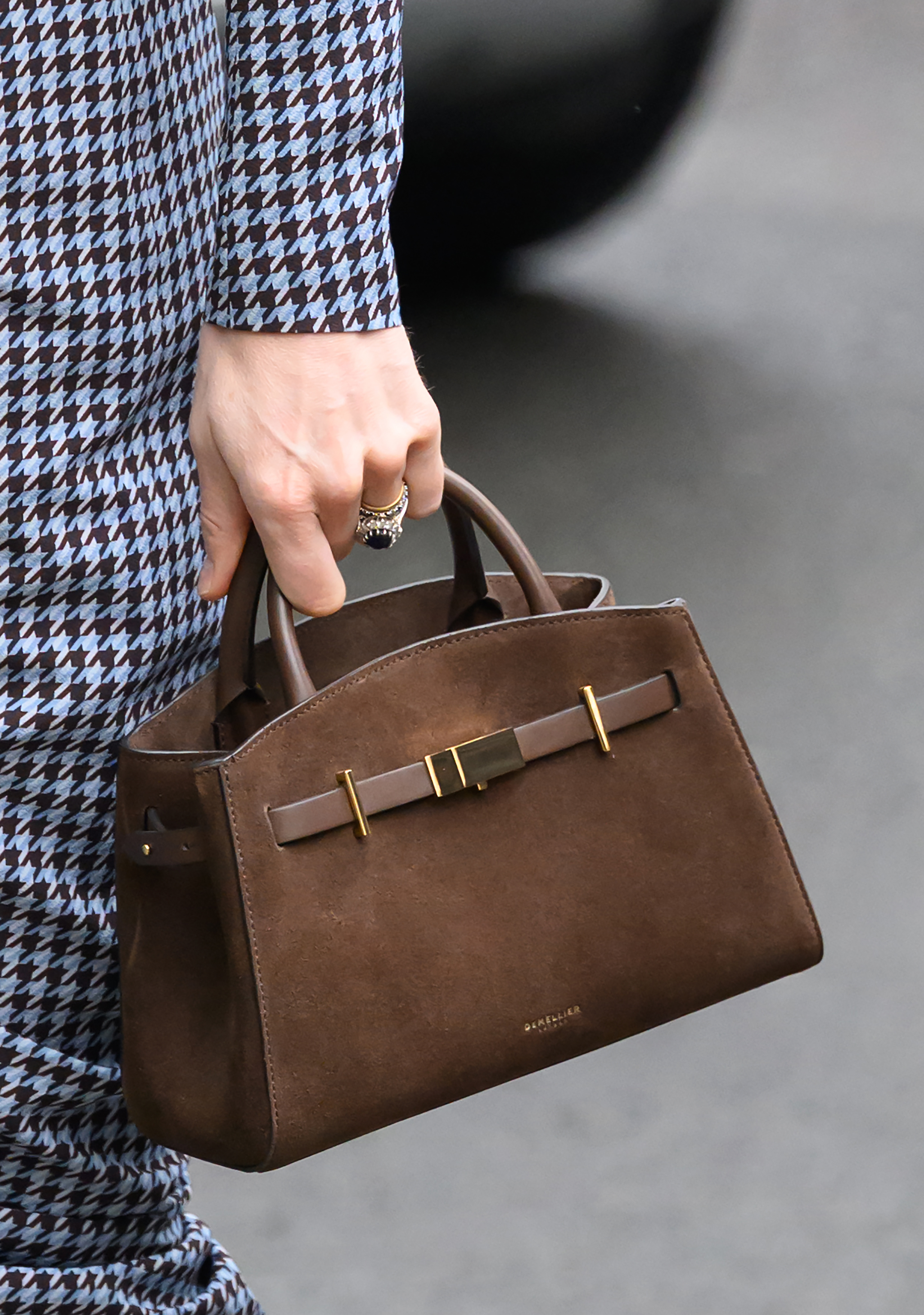 A closeup of Princess Kate's brown purse