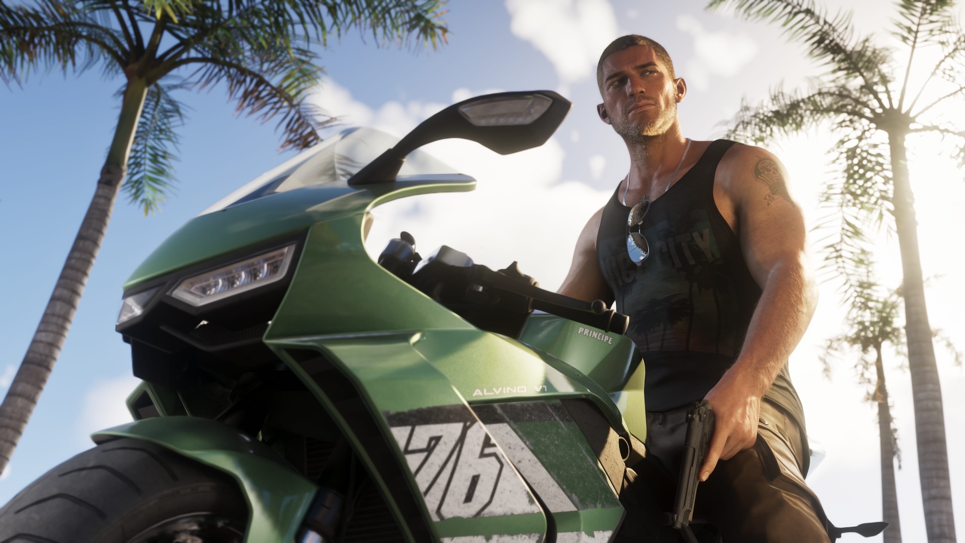 Jason Duval sits on a green super bike, with palm trees behind him