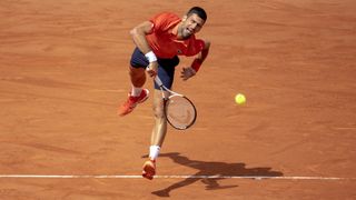Novak Djokovic serves at the French Open 2023