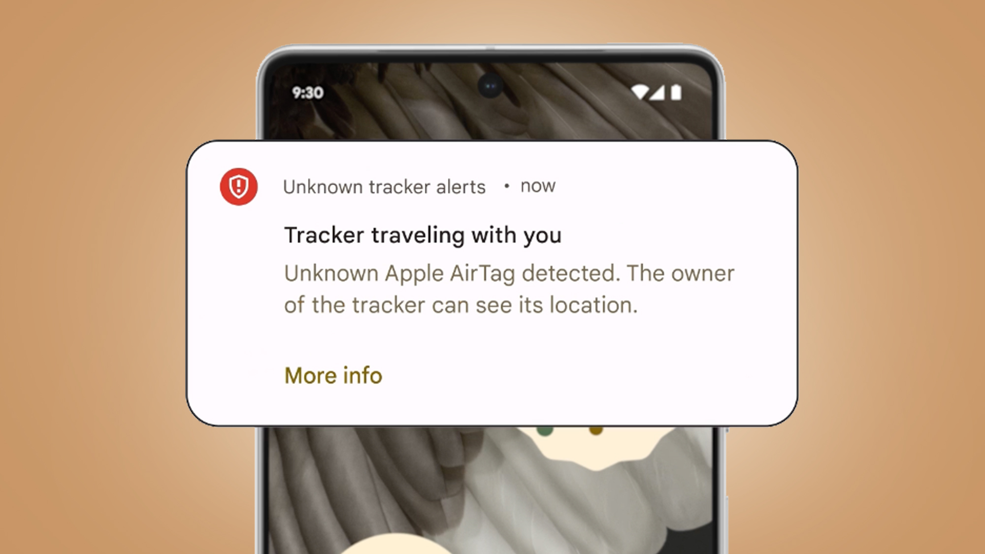 An Android phone on a beige background showing an alert about Apple AirTag tracking