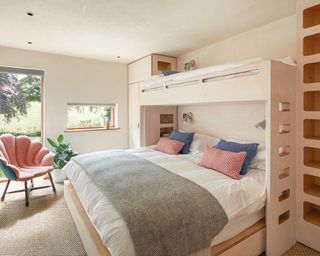 Small guest bedroom with wood bunk bed