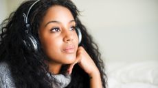 Young woman with headphones after using a CD ripper