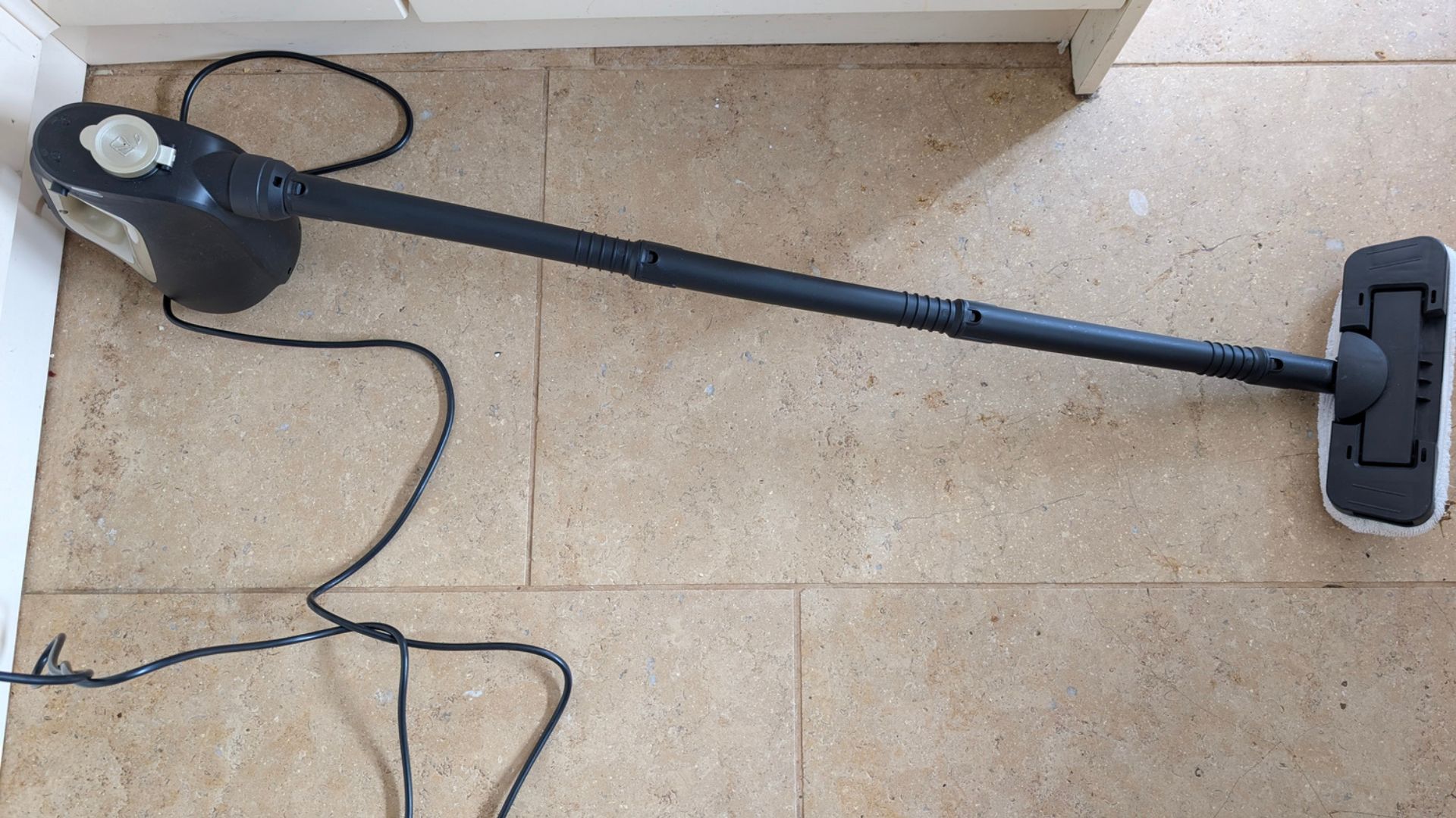 Testing the Beldray 15-in-1 Steam Cleaner with its lead on a tile floor