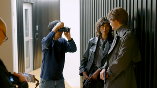 Hideo Kojima taking a photo of charlee fraser and bill skarsgard for Physint cover art