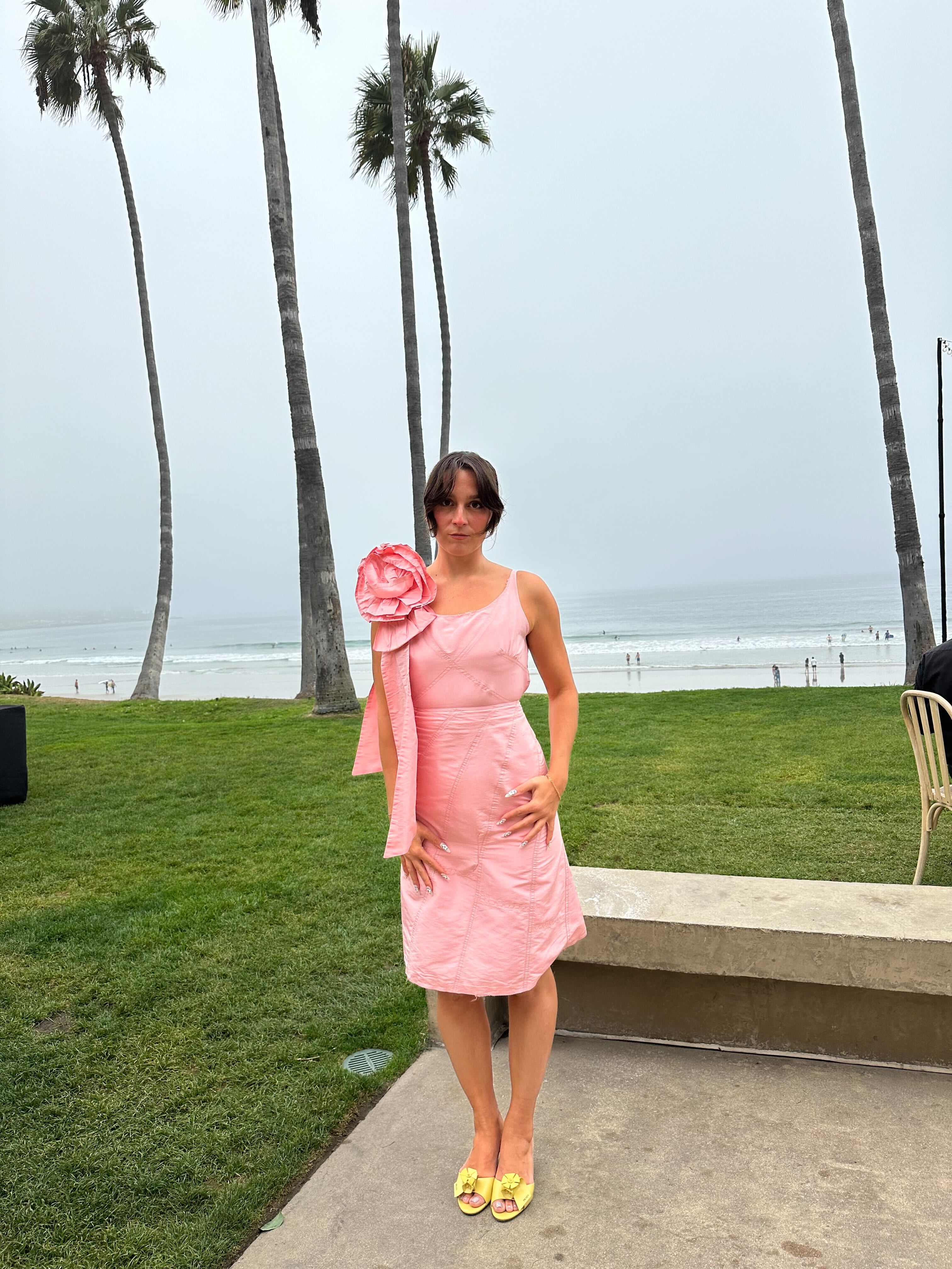 WWW editor wearing a wedding guest dress.