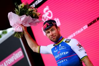 BALATONFURED HUNGARY MAY 08 Mark Cavendish of United Kingdom and Team QuickStep Alpha Vinyl celebrates winning the stage on the podium ceremony after the 105th Giro dItalia 2022 Stage 3 a 201km stage from Kaposvr to Balatonfred Giro WorldTour on May 08 2022 in Balatonfured Hungary Photo by Tim de WaeleGetty Images