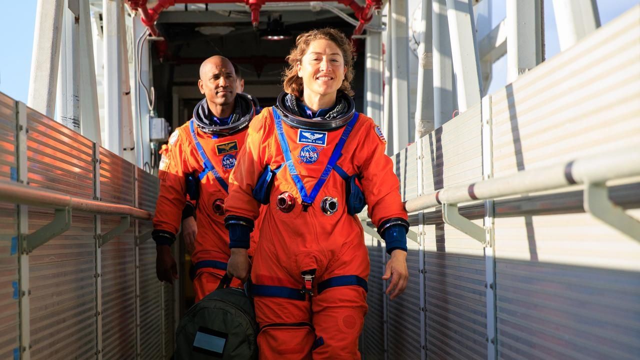Artemis 2 moon astronauts Christina Koch (front) and Victor Glover from NASA during launch simulations on Sept. 20, 2023. They were on the mobile launcher at NASA's Kennedy Space Center.