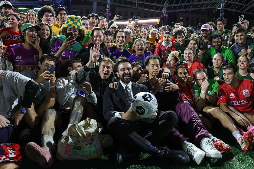 Democratic Mayor of New York City Zohran Mamdani (C) poses for a group photo with attendees to &quot;The Cost of Living Classic&quot; soccer tournament of NYC Footy soccer league on October 19, 2025 in New York City. 