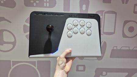 Man holding up FlexStrike Wireless Fight Stick against wall