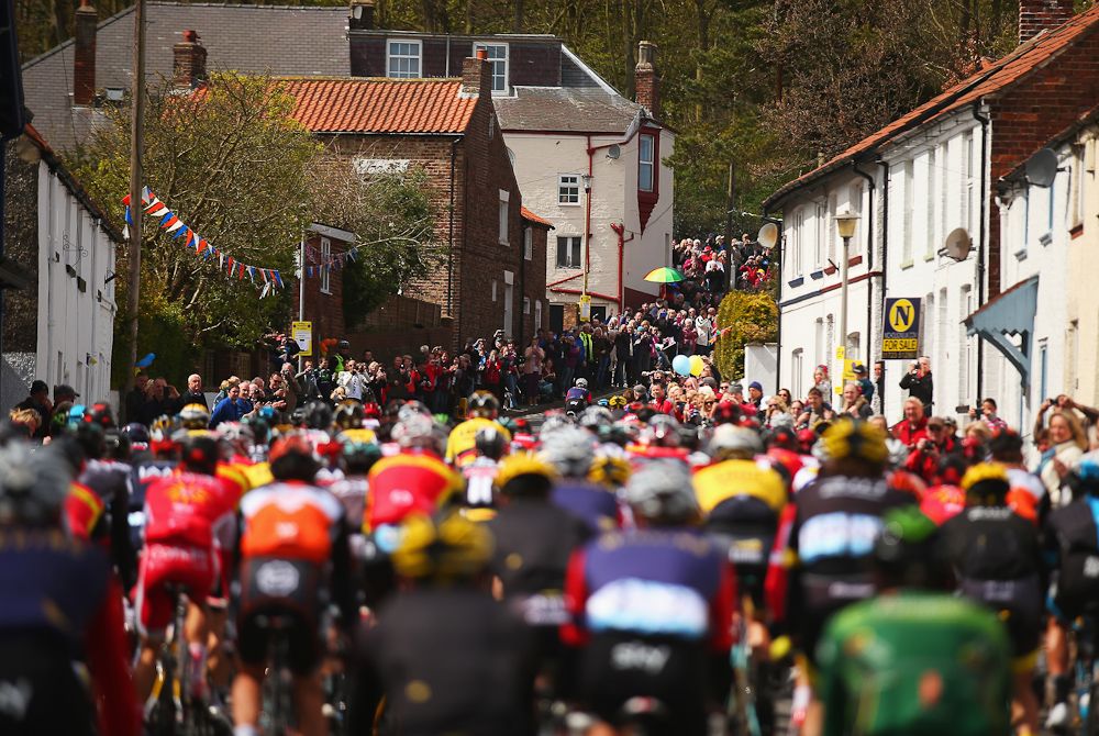 Fans cheer on the peloton during Stage 1 of the Tour of Yorkshire from Bridlington to Scarborough