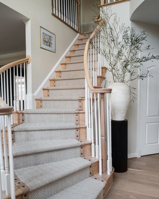 wood staircase with neutral stair runner by LP & Co