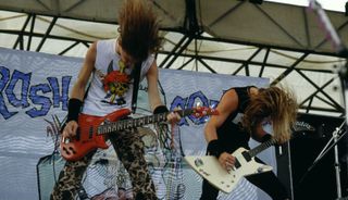 Metallica's Jason Newsted (left) and James Hetfield perform onstage at Castle Donington in Donington, England on August 22, 1987