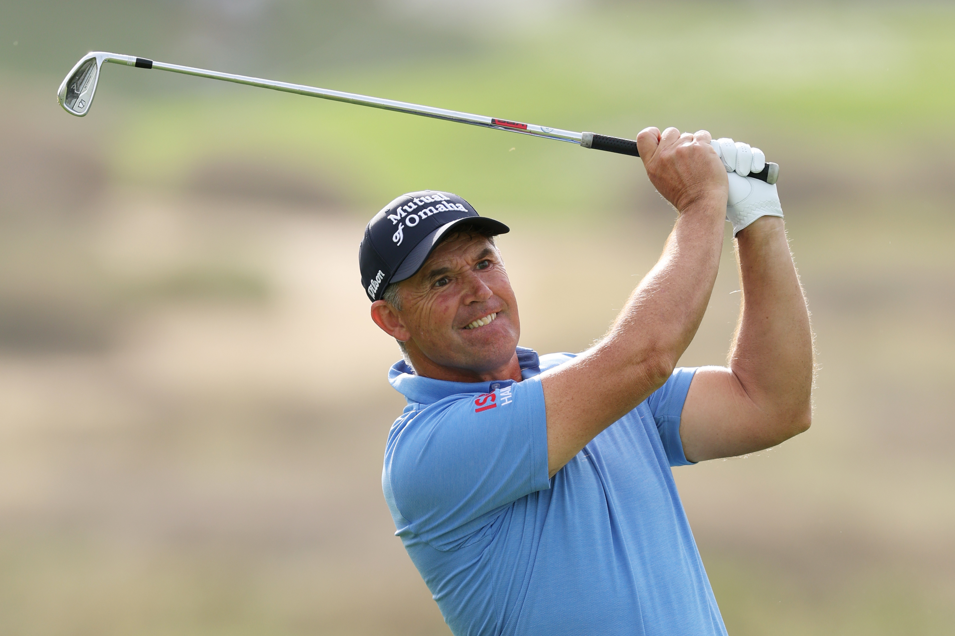 Padraig Harrington holds his finish on an iron shot