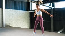 Woman jumping during a burpee