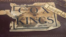Cox & Kings battered suitcase