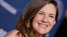 drew barrymore on a blue background