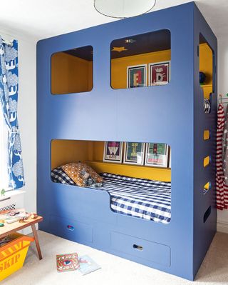 kids room with blue and yellow bunk bed
