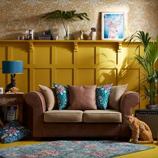living room with sofa and printed wall