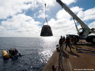 Dragon Capsule Lifted onto Barge
