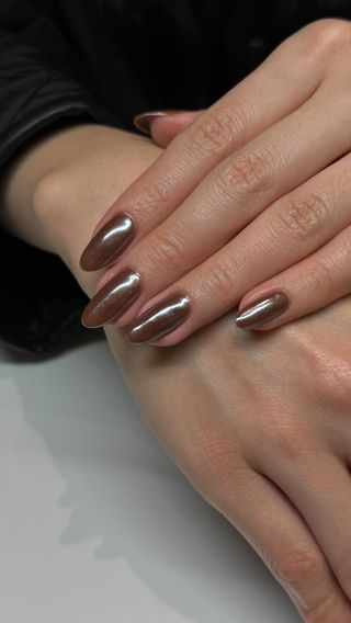 Long oval nails with brown metallic polish