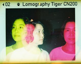 100 film frame of a multi-exposure portrait with multi-color flash effects