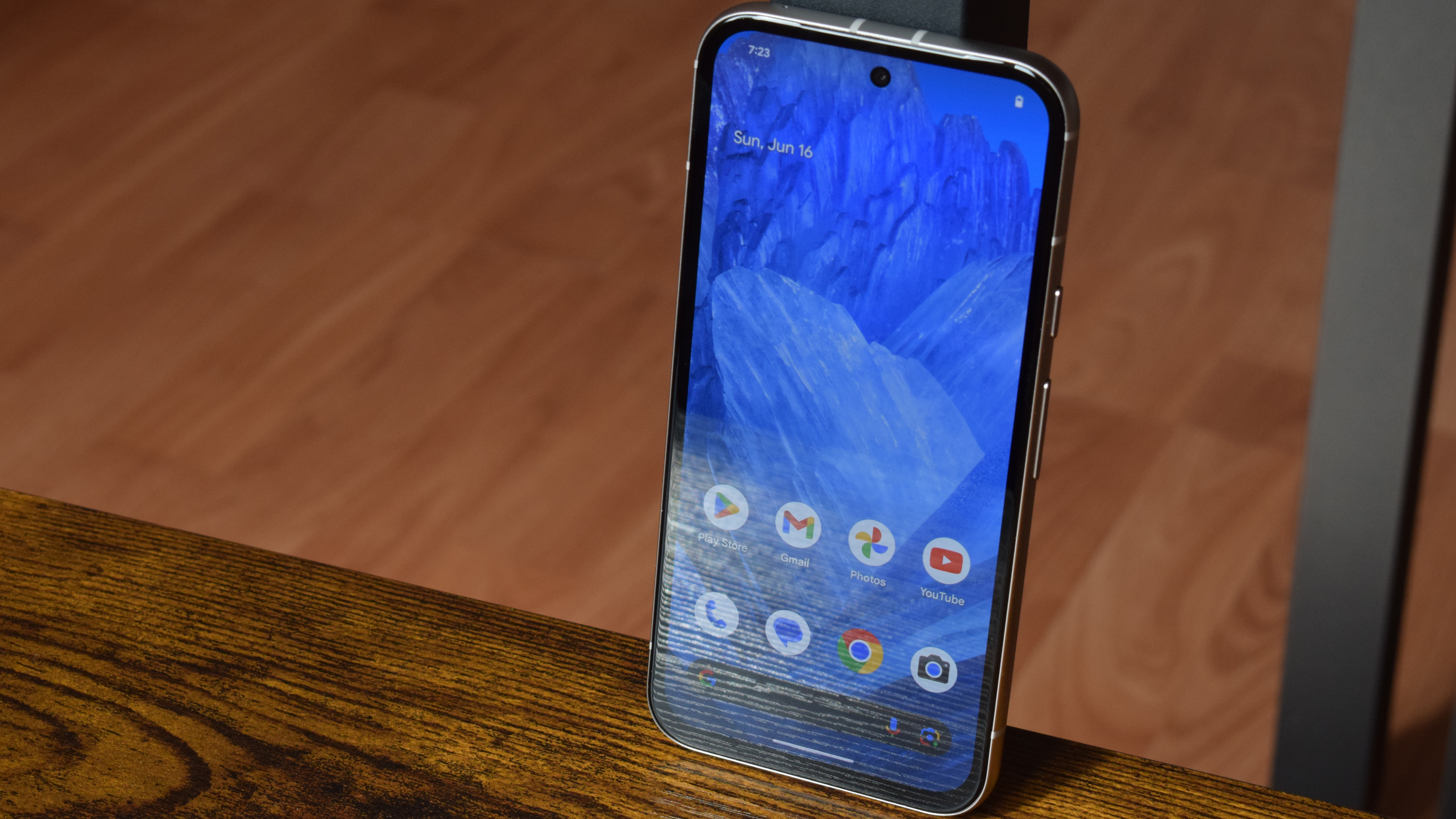 Google Pixel 8a on a table with the display turned on