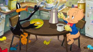 Daffy Duck and Porky Pig happily sit in the middle of a messy kitchen in The Day The Earth Blew Up.