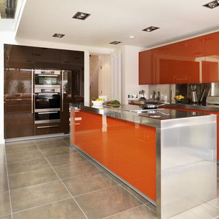 kitchen area with brown kitchen units and tiles flooring