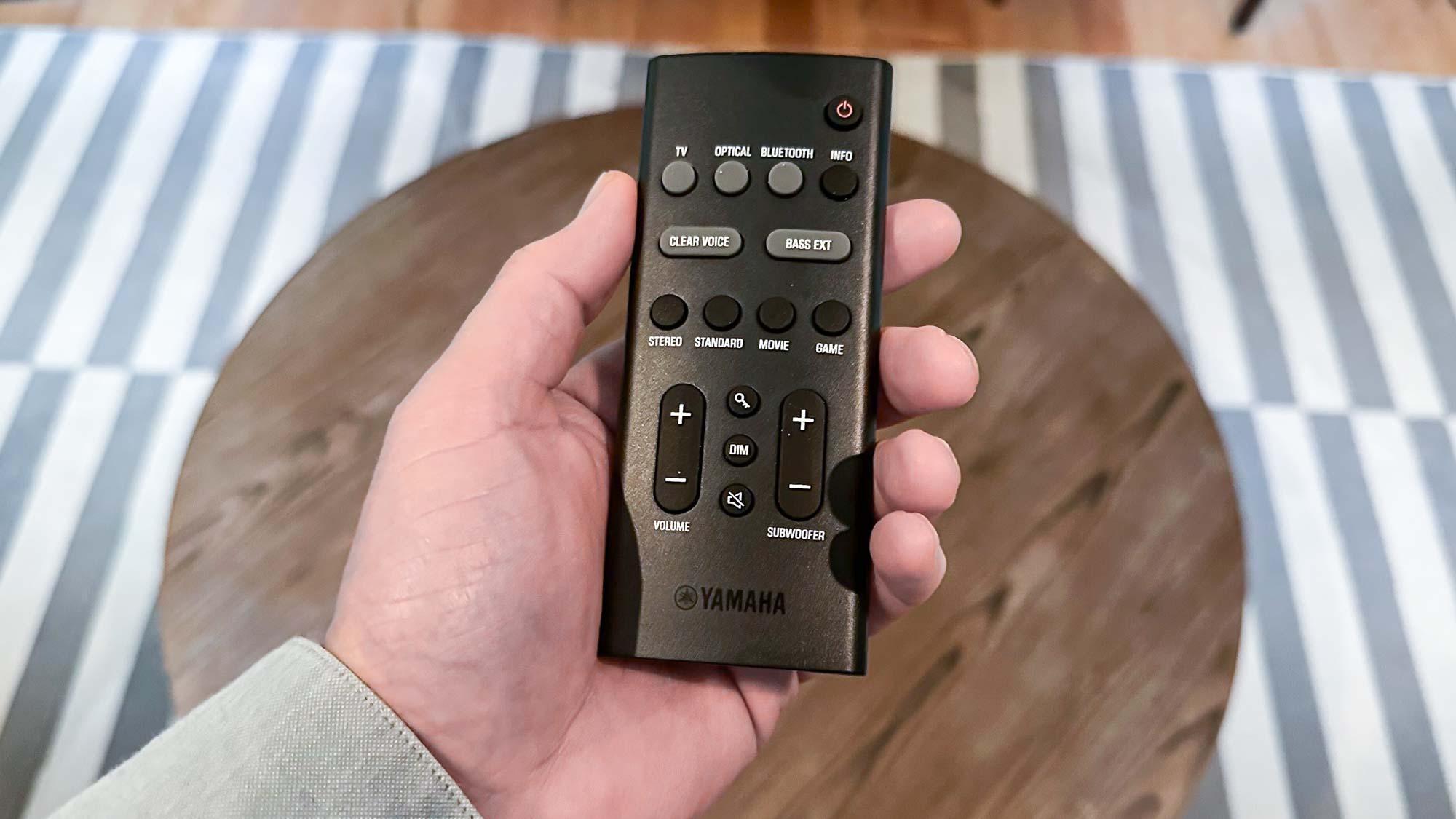 Remote handset in hand for the Yamaha SR-B40A