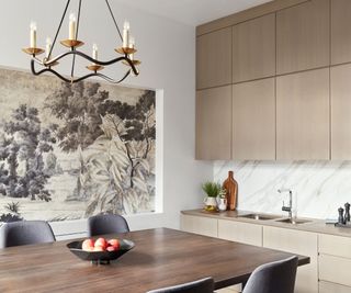 kitchen with dining table mural and beige cabinetry