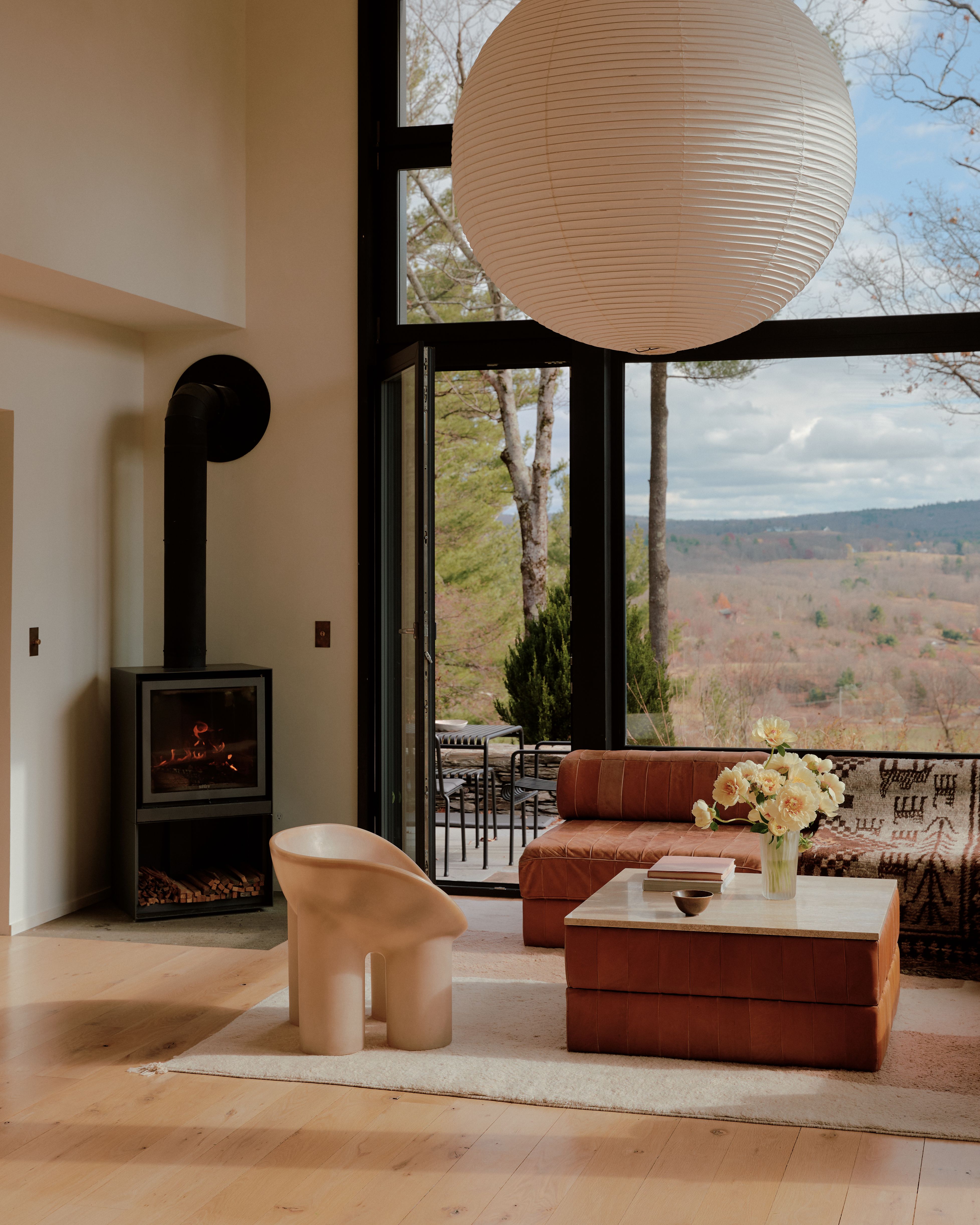 Living rooms with playful, sculptural designer piece and lots of natural light. 