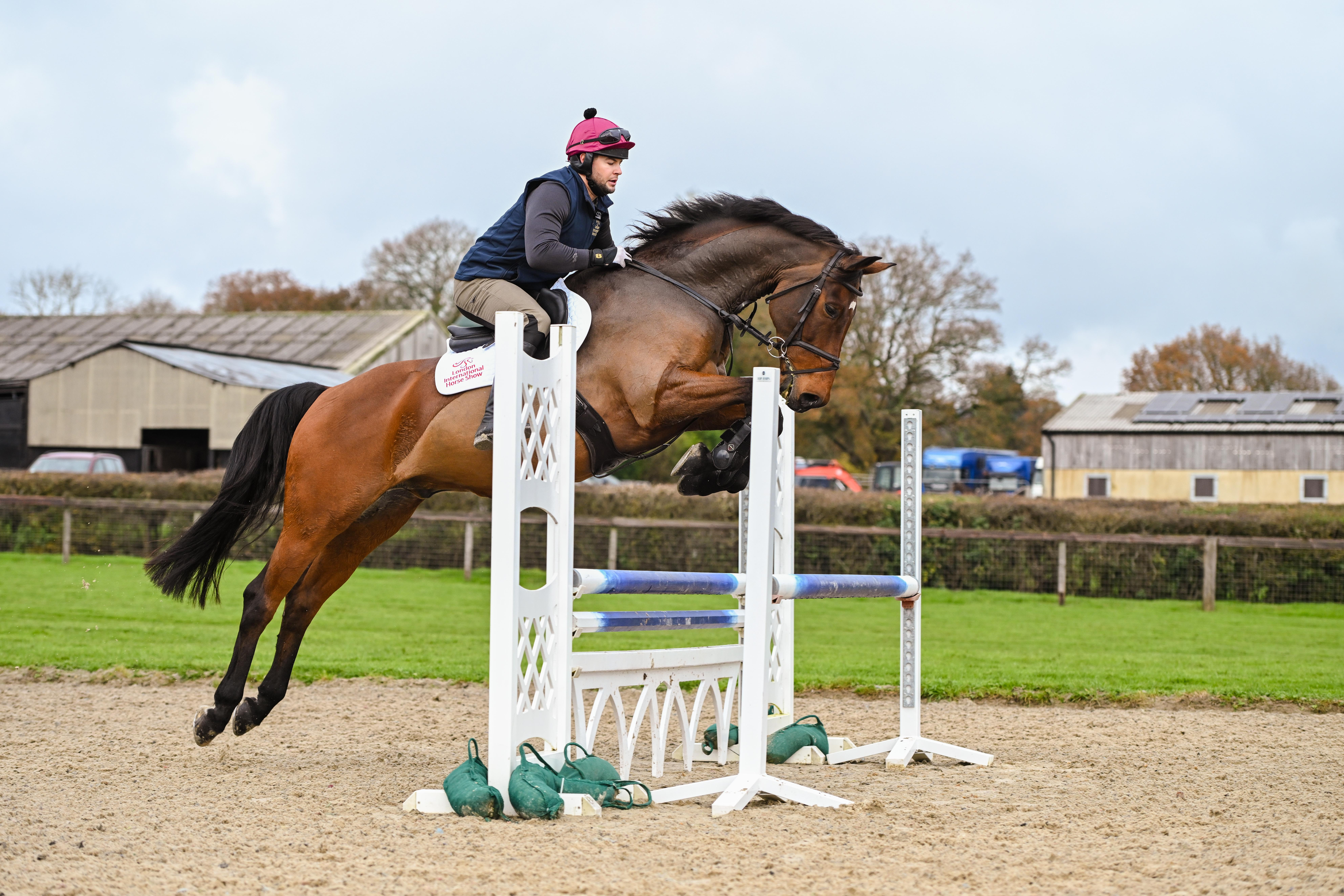Former Love Island star and ITV Racing presenter Chris Hughes is a LIHS ambassador. He enjoys a lesson alongside Oisin Murphy from top showjumper William Funnell.