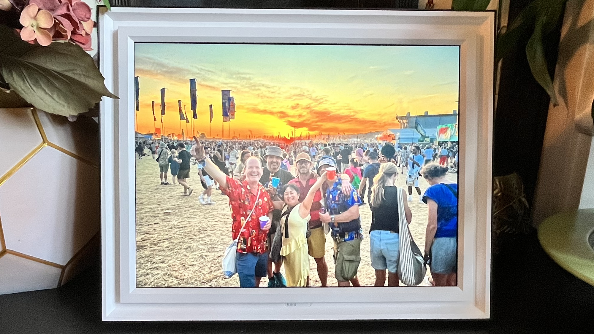 Pix-Star Lux 17-inch digital photo frame with image of revelers at Glastonbury Festival at sunset