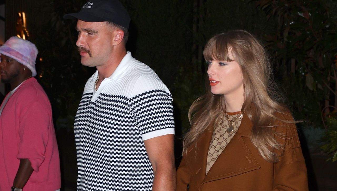 Taylor Swift and Travis Kelce walking in New York City wearing Gucci outfits