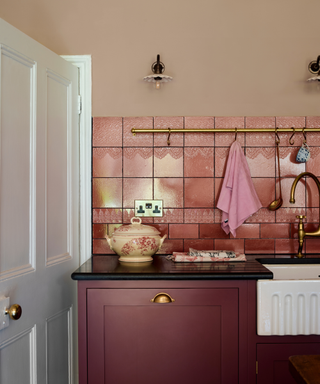 A pink and red Shaker kitchen