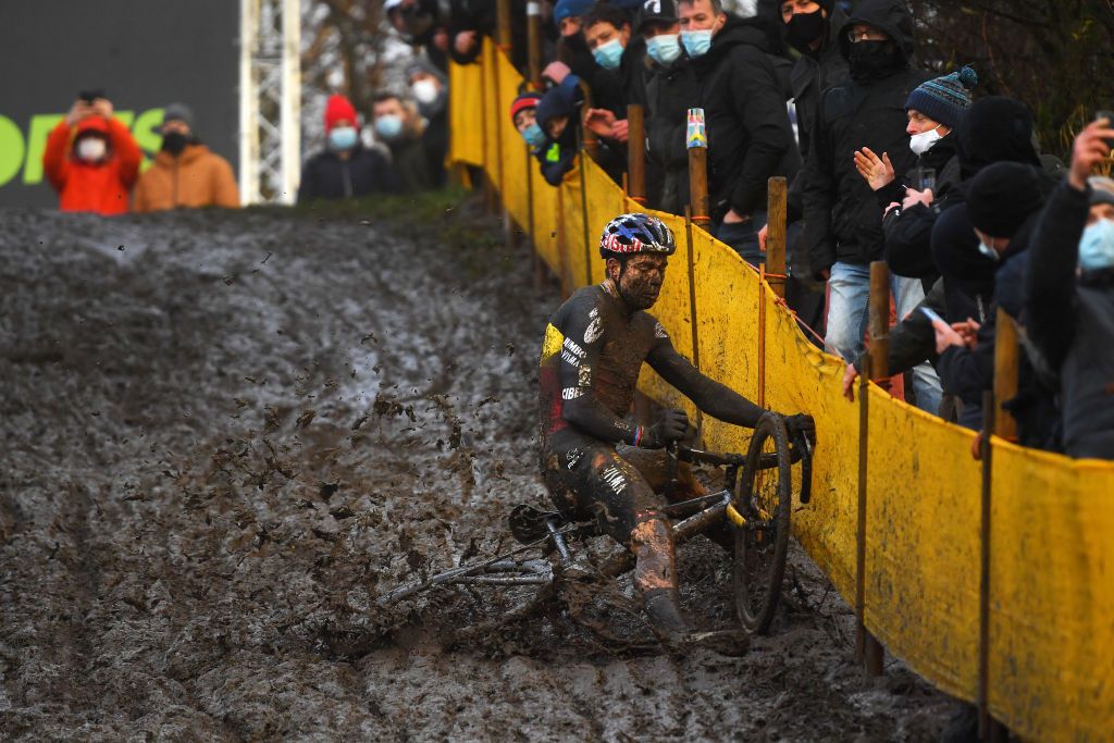 BOOM BELGIUM DECEMBER 04 Wout Van Aert of Belgium and Team Jumbo Visma falls on a muddy sector during the 7th Superprestige Cyclocross Boom 2021 Mens Elite SPBoom Superprestige2022 on December 04 2021 in Boom Belgium Photo by Luc ClaessenGetty Images