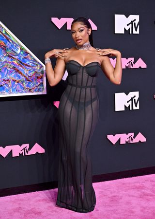 Megan Thee Stallion attends the 2023 MTV Video Music Awards in a sheer bustier dress that flaunted her thong