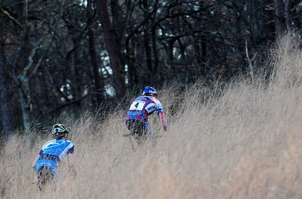 Ryan Trebon (Kona) leading 19-year-old Valentin Scherz (Procycles-Scott-Newwork) through the tall grass.