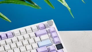 A white and purple Epomaker Ajazz AK820 Pro mechanical keyboard