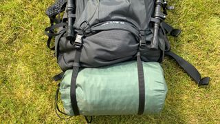 Gear attached to a backpack