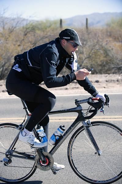Tomas Vaitkus does some multi-tasking during the sponsor ride.