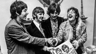 The Beatles hold the sleeve of their new LP, 'Sgt. Pepper's Lonely Hearts Club Band', at the press launch for the album, held at Brian Epstein's house at 24 Chapel Street, London, 19th May 1967.