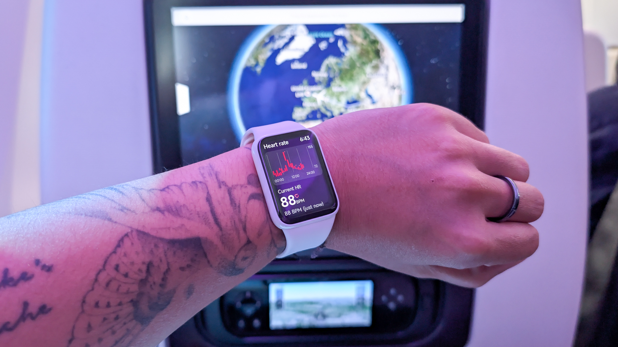 A person wearing a Xiaomi Smart Band 10 Pro smartwatch