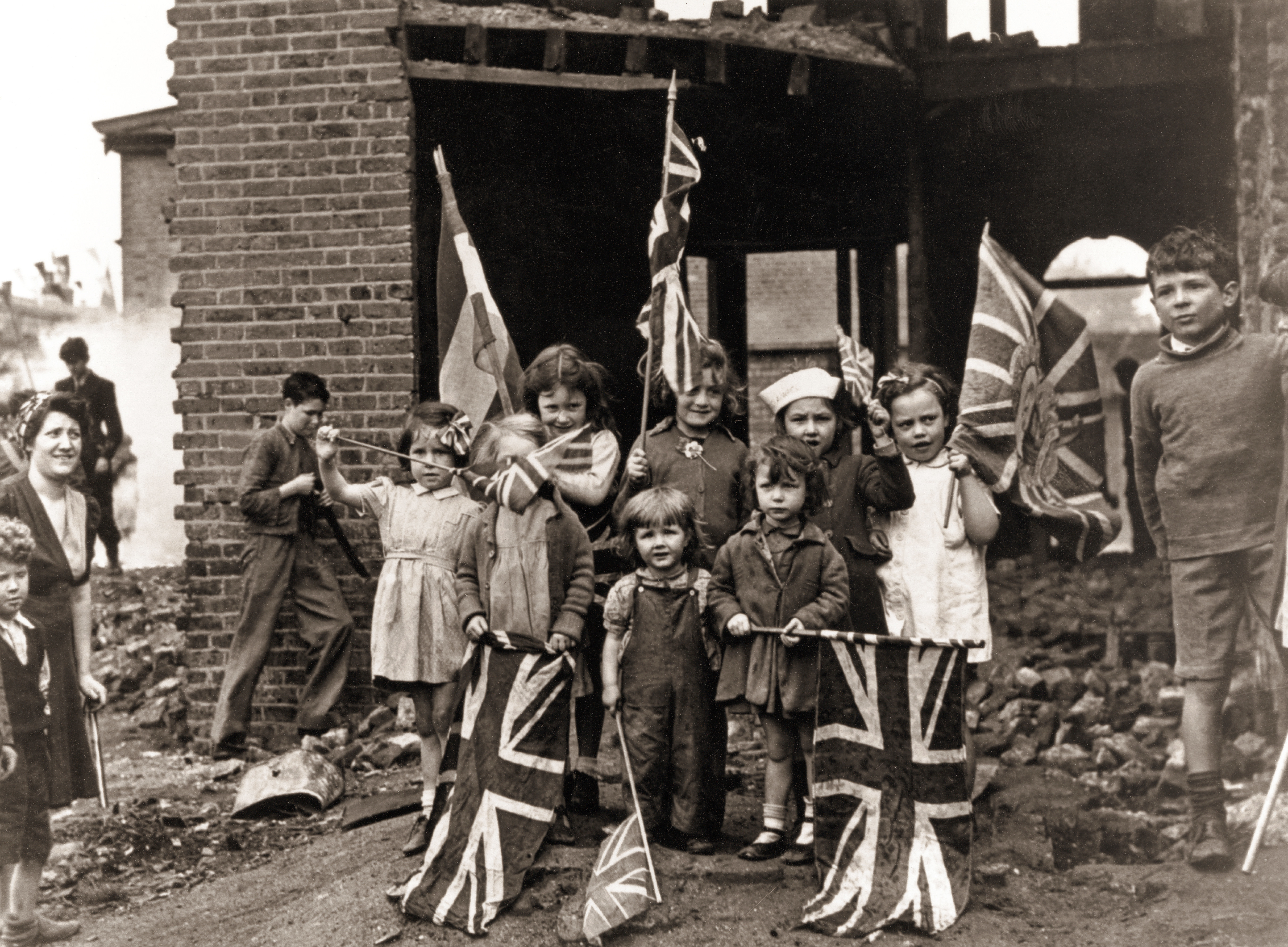 Young children in bomb-scarred Battersea in south London with their Union Jacks.