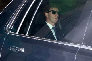 Mark Zuckerberg, chief executive officer of Meta Platforms Inc. rides in a limo wearing sunglasses.