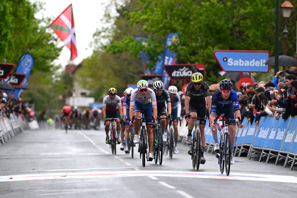KANBO FRANCE APRIL 02 LR Steff Cras of Belgium and Team TotalEnergies Damien Howson of Australia and Q365 Pro Cycling Team and Quentin Pacher of France and Team Groupama FDJ cross the finish line during the 63rd Itzulia Basque Country 2024 Stage 2 a 160km stage from Irun to Kanbo UCIWWT on April 02 2024 in Kanbo France Photo by Tim de WaeleGetty Images