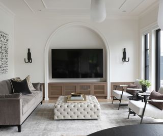 living room with TV and taupe sofa